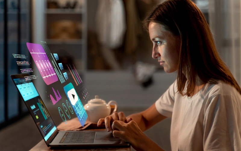 Employee interacting with an AI-powered, scenario-based training module on a laptop. Represents immersive learning without VR using accessible, screen-friendly digital content.